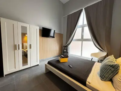 a bedroom with a bed with a large window at Cruilles 13 in Valencia