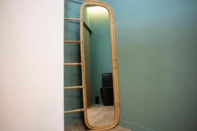 a mirror with a wooden frame in a room at Nomad Haux Mestalla Room 101 in Valencia