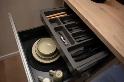 an open drawer with a hat and utensils in it at Nomad Haux Mestalla Room 101 in Valencia