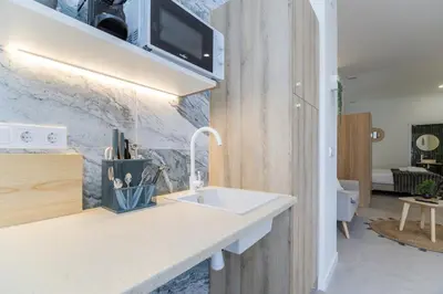 a kitchen with a sink and a counter top at PPA22 Loft Valencia - Acogedor loft cercano al metro Zona Ayora in Valencia