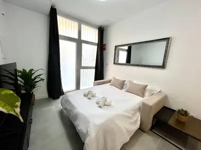 a bedroom with a bed with two teddy bears on it at Valencia Getaway - Jacuzzi, Space & Comfort in Valencia