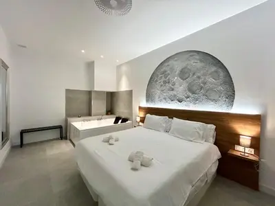 a bedroom with a bed with two teddy bears on it at Valencia Getaway - Jacuzzi, Space & Comfort in Valencia