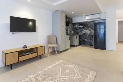 a living room with a flat screen tv on a wall at PALX Loft Valencia - Estudio contemporáneo cerca de las Artes y las Ciencias in Valencia