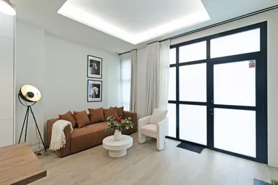 a living room with a couch and a chair at GuestReady - Urban elegance in Valencia in Valencia