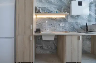 a kitchen with a sink and a refrigerator at UY - Loft Valencia Acogedores y modernos estudios cerca de la estación Joaquín Sorolla in Valencia