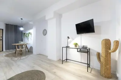 a living room with a flat screen tv on a wall at LN4 - Loft Valencia Espacioso y acogedor estudio cerca del metro zona Ayora in Valencia