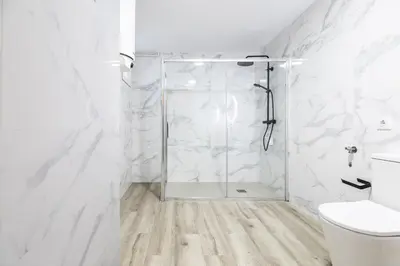 a white bathroom with a shower and a toilet at LN4 - Loft Valencia Espacioso y acogedor estudio cerca del metro zona Ayora in Valencia