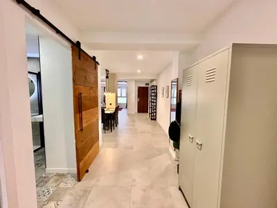 a hallway with a room with a dining room at Turia Gardens & Science & Center in Valencia