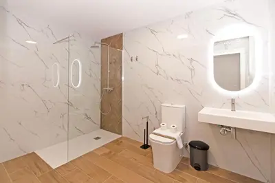 a bathroom with a toilet and a sink and a shower at GuestReady - A lovely studio in la Saidia Valencia in Valencia