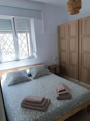 a bedroom with a bed with two towels on it at Apartamento al lado de la playa Malvarrosa in Valencia