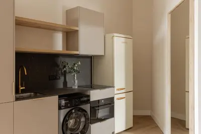 a kitchen with a washer and dryer in a room at MH Apartments Central Valencia in Valencia