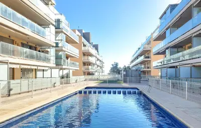 a swimming pool in the middle of a building at Cozy Apartment In Moncofa in Moncófar