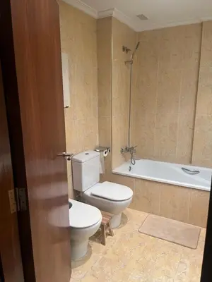 a bathroom with a toilet and a bath tub at Casa Dani in Sueca