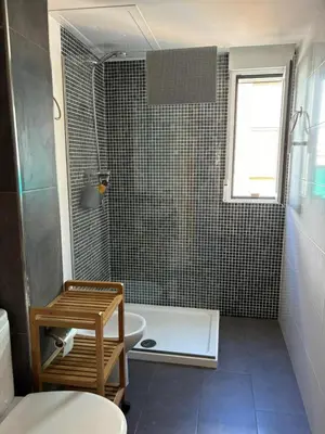 a bathroom with a shower and a toilet and a sink at Apartment near the beach in Valencia