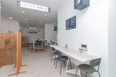 a room with a table and chairs in a room at Moreno Rooms by BET Apartments in Valencia