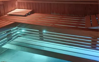 a bench in a sauna with the light on at Amazing Home In Macastre With Sauna in Macastre