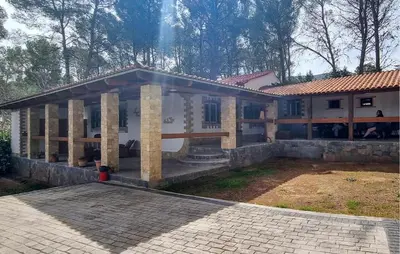 a house with a large patio in front of it at Amazing Home In Macastre With Sauna in Macastre