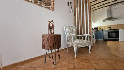 a living room with two chairs and a table at La Replaceta in Segorbe