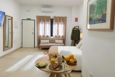 a room with a bed and a table with fruit on it at Loft 9B JAIME II in Valencia
