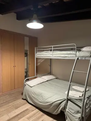 a bedroom with two bunk beds and a closet at Miguelete tower & 4th FLOOR & City center and no elevator in Valencia