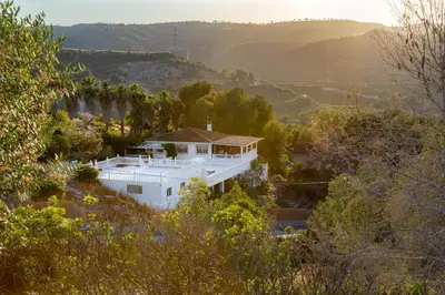 an aerial view of a white house in the hills at Casa Roka in Alberique