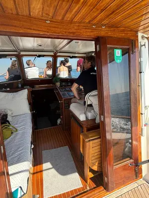 a group of people sitting in the back of a boat at Xanquete in Valencia