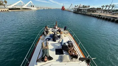 a group of people on a boat in the water at Xanquete in Valencia