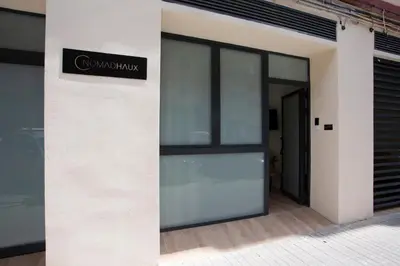 a sign on the side of a building at Nomad Haux Mestalla Apartments in Valencia