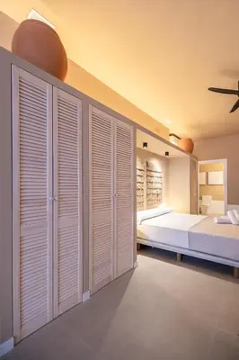 a bedroom with white closets and a bed at Abastos by Concept Flats in Valencia