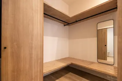 a dressing room with a mirror and wooden walls at Porto by Concept Flats in Valencia