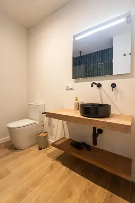 a bathroom with a sink and a toilet at Porto by Concept Flats in Valencia
