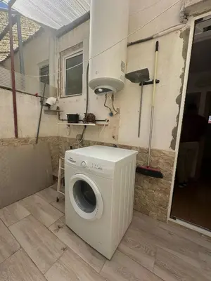 a washer and dryer sitting in a room at Casa con Barbacoa en Urbanización Privada in Valencia