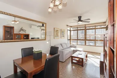 a living room with a table and a couch at GuestReady - Delightful Valencia Retreat in Valencia