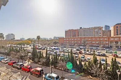 a parking lot with parked cars in a city at GuestReady - Delightful Valencia Retreat in Valencia