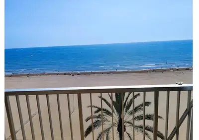 a view of a beach with the ocean at El Retiro - Frontal al mar, 1a Línea, como en tu casa in Cullera