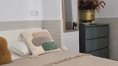 a bedroom with a bed with a mirror and a dresser at Las Artes Luxury Double Room in Valencia
