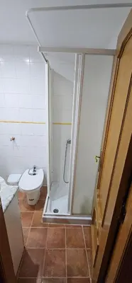 a bathroom with a shower and a toilet at Vacansis Plaza de la Reina in Valencia