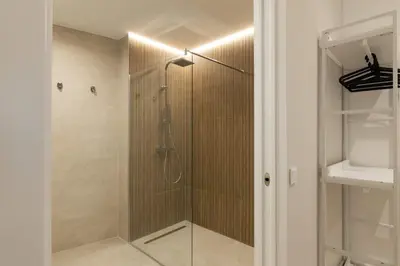 a shower with a glass door in a bathroom at Luxury Apartment Oceanografic 6 pax in Valencia