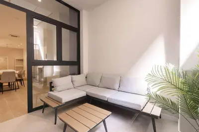 a living room with a white couch and a table at Luxury Apartment Oceanografic 6 pax in Valencia