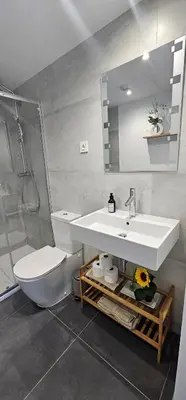 a bedroom with a bed in a white room at Dúplex-Lofts Les Arts i Les Ciències in Valencia