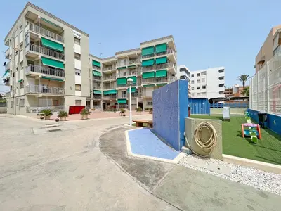an empty street in a city with tall buildings at Global Vacacional, Apartamento en primera linea de playa en Canet de Berenguer in Canet de Berenguer