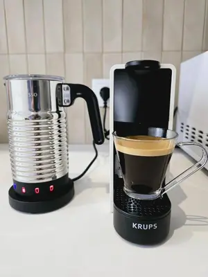 a coffee maker sitting on a counter next to a cup of coffee at Cozy Retreat in Heart of Valencia Perfect for Couples n Families in Valencia