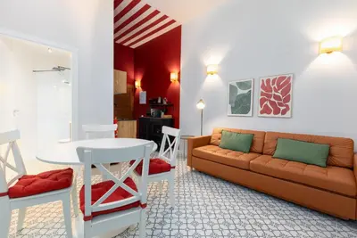 a living room with a couch and a table at The Little Village Apartments in Valencia