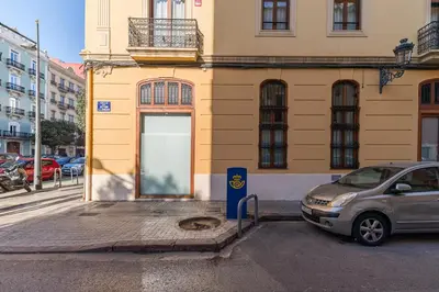 a car parked in front of a building at Suite Premium junto al Río Turia 2 in Valencia