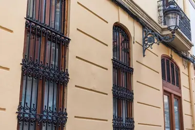 a building with balconies on the side of it at Premium Suite by the Turia River 3 in Valencia