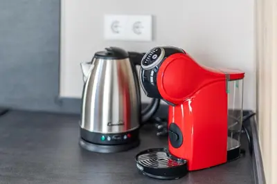 a red coffee maker sitting on a kitchen counter at Premium Suite by the Turia River 4 in Valencia
