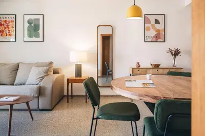 a living room with a table and a couch at Seaview Flat Patacona in Valencia