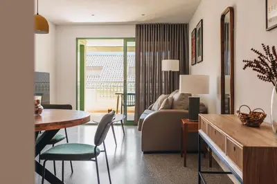 a living room with a couch and a table at Seaview Flat Patacona in Valencia