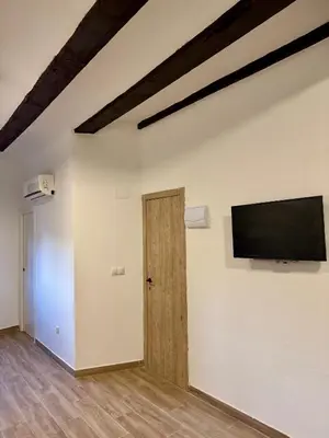 a room with a flat screen tv on a wall at Piso 3 - Apartamento Mercado Central in Valencia