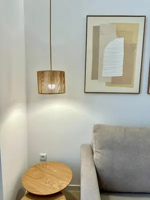 a living room with a couch and a table at Anelsa Suites Serranos 1 in Valencia